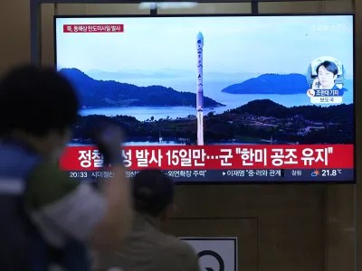 A TV screen shows a report of North Korea's missile launch with file image during a news program at the Seoul Railway Station in Seoul, South Korea, Thursday, June 15, 2023. North Korea test-fired a ballistic missile off its east coast on Thursday, hours after South Korean and U.S. troops ended a fifth round of large-scale live-fire drills near the Koreas' heavily fortified border. The letters read " North Korea, launched ballistic missile to east coast." (AP Photo/Lee Jin-man)