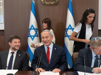 Israeli Prime Minister Benjamin Netanyahu, centre, and Finance Minister Bezalel Smotrich, left, attend a weekly cabinet meeting in the prime minister's office in Jerusalem, June 18, 2023. Ohad Zwigenberg/Pool via REUTERS