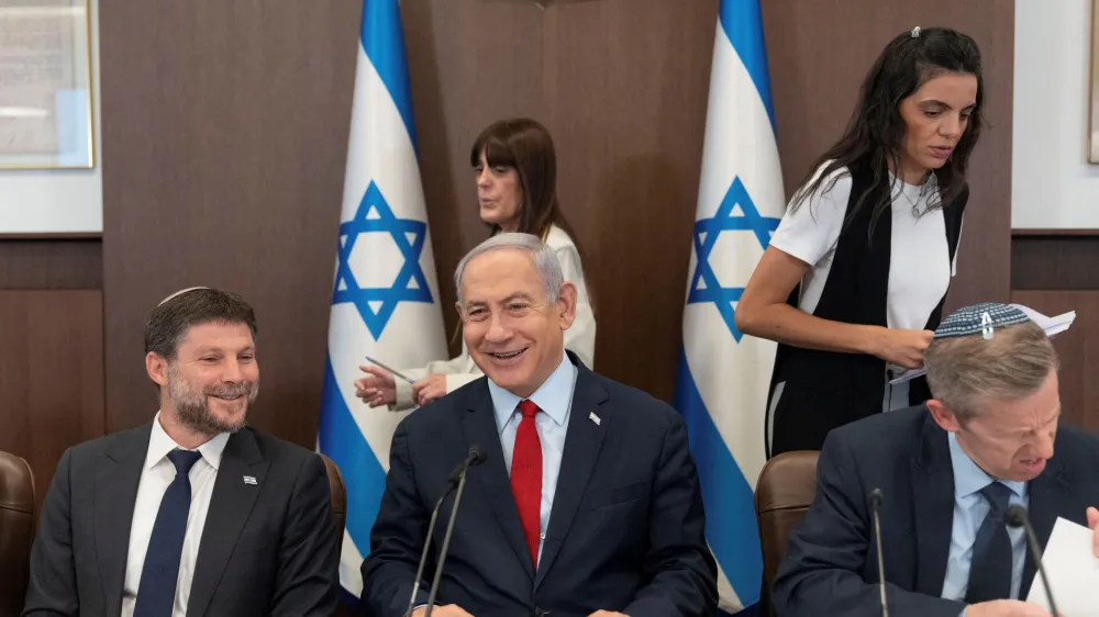 Israeli Prime Minister Benjamin Netanyahu, centre, and Finance Minister Bezalel Smotrich, left, attend a weekly cabinet meeting in the prime minister's office in Jerusalem, June 18, 2023. Ohad Zwigenberg/Pool via REUTERS