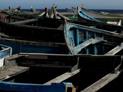 FILE PHOTO: Dozens of wooden boats used by migrants to reach the Canary Islands are seen at the Port of Arinaga, in the island of Gran Canaria, Spain, June 7, 2022. Picture taken June 7, 2022. REUTERS/Borja Suarez/File Photo