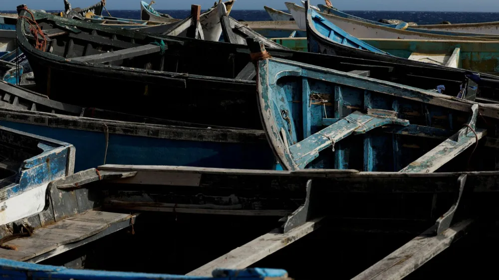 FILE PHOTO: Dozens of wooden boats used by migrants to reach the Canary Islands are seen at the Port of Arinaga, in the island of Gran Canaria, Spain, June 7, 2022. Picture taken June 7, 2022. REUTERS/Borja Suarez/File Photo