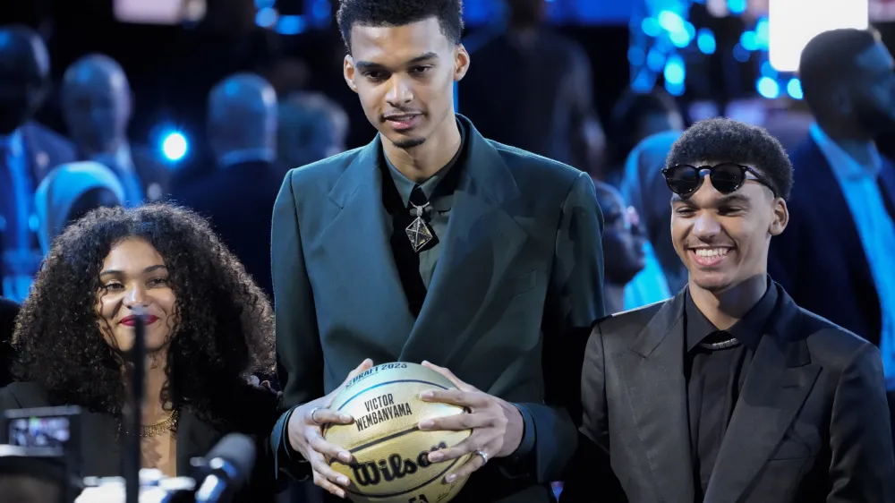 Victor Wembanyama reacts during introductions before the NBA basketball draft, Thursday, June 22, 2023, in New York. (AP Photo/John Minchillo)