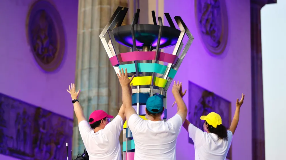 25 June 2023, Berlin: The Olympic flame goes out during the closing ceremony of the Special Olympics World Games in Berlin. Photo: Jean-Marc Wiesner/dpa