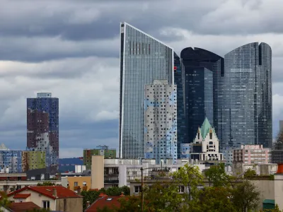 A general view shows the Tours Aillaud, the towers of the Pablo Picasso district, in Nanterre, a suburban town where riots began after the death of Nahel, a 17-year-old teenager killed by a French police officer in Nanterre during a traffic stop, Paris suburb, France, July 1, 2023. In the background, skyscraper office properties of La Defense business and financial district. REUTERS/Yves Herman