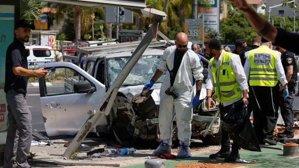 Israeli security and emergency personnel work at the scene of a ramming attack in Tel Aviv, Israel July 4, 2023. REUTERS/Amir Cohen