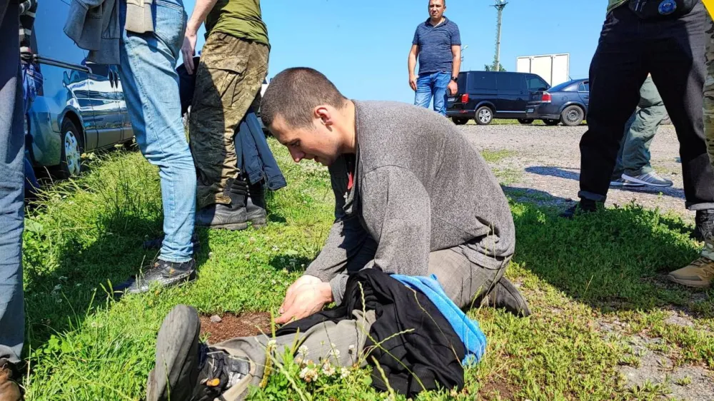 Ukrainian prisoners of war (POW) are seen after a swap, amid Russia's attack on Ukraine, at an unknown location in Ukraine, in this handout picture released July 6, 2023. Head of Ukraine's Presidential Office Andriy Yermak via Telegram/Handout via REUTERS ATTENTION EDITORS - THIS IMAGE HAS BEEN SUPPLIED BY A THIRD PARTY.