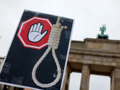 A placard is seen during a protest against the Islamic regime of Iran following the death of Mahsa Amini, in Berlin, Germany, December 10, 2022. REUTERS/Michele Tantussi