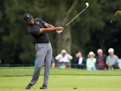 ﻿Sep 8, 2018; Newtown Square, PA, USA; Tiger Woods hits his approach shot on the 3rd hole during the third round of the BMW Championship golf tournament at Aronimink GC. Mandatory Credit: Bill Streicher-USA TODAY Sports