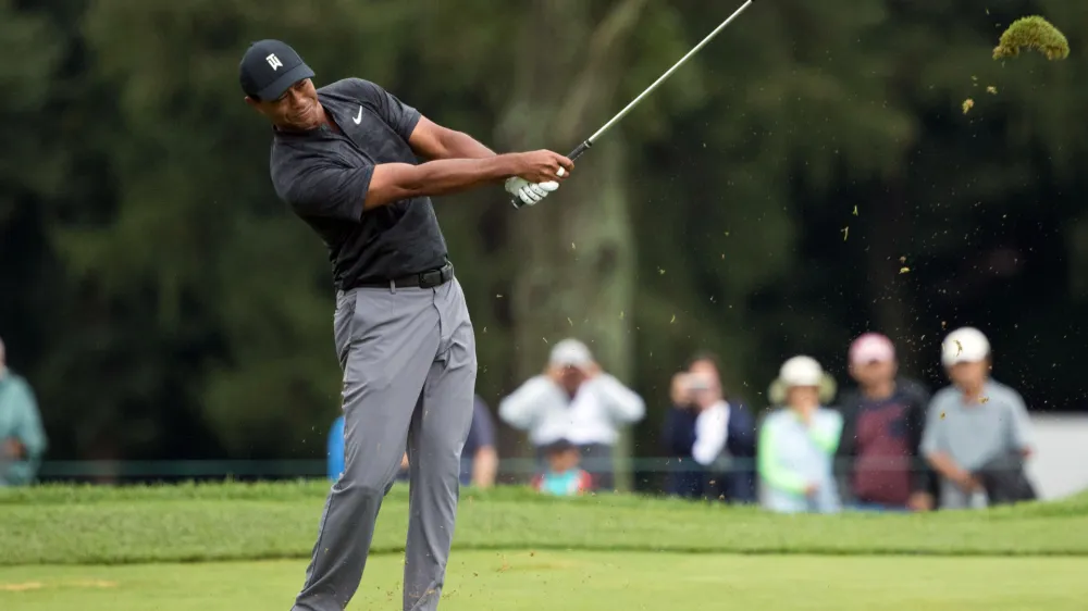 ﻿Sep 8, 2018; Newtown Square, PA, USA; Tiger Woods hits his approach shot on the 3rd hole during the third round of the BMW Championship golf tournament at Aronimink GC. Mandatory Credit: Bill Streicher-USA TODAY Sports