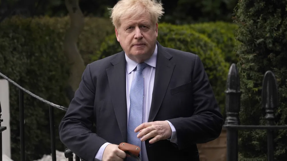 FILE - Boris Johnson leaves his house in London, on March 22, 2023. Former Prime Minister Boris Johnson deliberately misled Parliament about the lockdown-flouting parties that undermined his credibility and contributed to his downfall, a committee of lawmakers said Thursday, June 15, 2023 after a year-long investigation. (AP Photo/Alberto Pezzali, File)