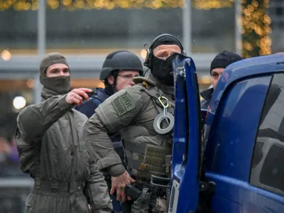 Security forces secure the area at a Christmas market in Dresden, Germany, December 10, 2022. REUTERS/Matthias Rietschel