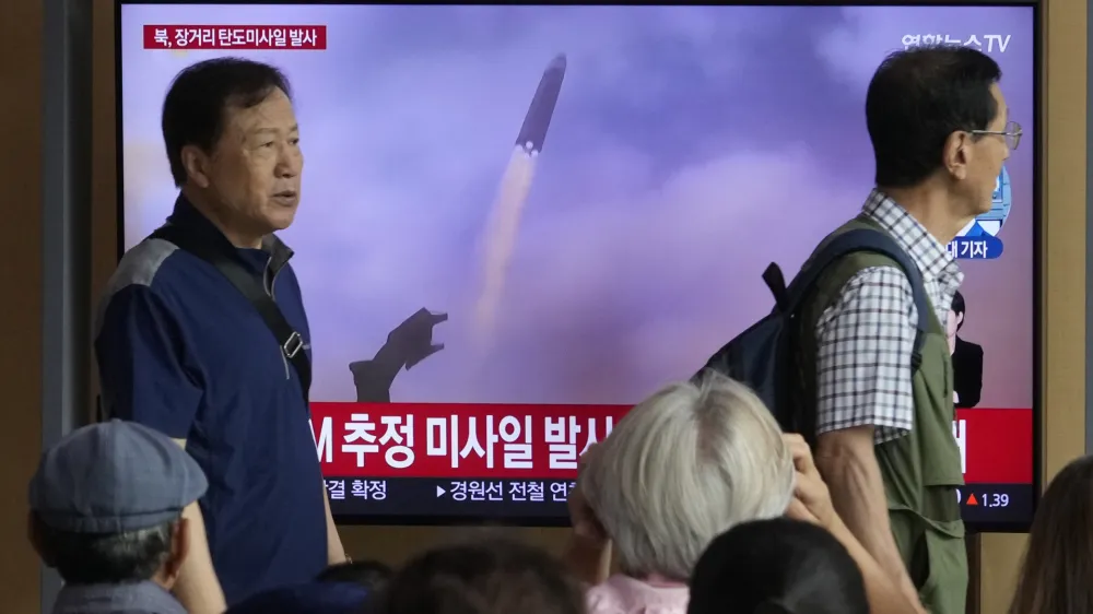 A TV screen shows a file image of North Korea's missile launch during a news program at the Seoul Railway Station in Seoul, South Korea, Wednesday, July 12, 2023. North Korea launched a long-range ballistic missile toward its eastern waters Wednesday, its neighbors said, two days after the North threatened "shocking" consequences to protest what it called a provocative U.S. reconnaissance activity near its territory. (AP Photo/Ahn Young-joon)