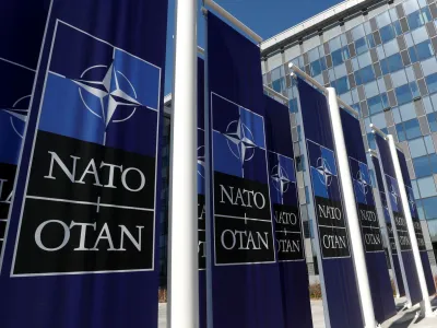 FILE PHOTO: Banners displaying the NATO logo are placed at the entrance of new NATO headquarters during the move to the new building, in Brussels, Belgium April 19, 2018. REUTERS/Yves Herman/File Photo