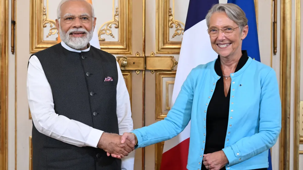 French Prime Minister Elisabeth Borne shakes hands with Indian Prime Minister Narendra Modi before their talks, Thursday, July 13, 2023 in Paris. Modi is on a two-day visit an will attend Bastille Day parade Friday with French President Emmanuel Macron. (Emmanuel Dunand, Pool via AP)