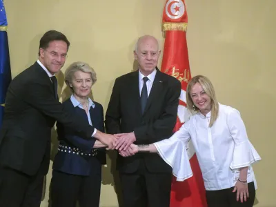 In this photo provided by the Tunisian Presidency, Tunisian President Kais Saied, centre, right, shakes hand with Netherlands' Prime Minister Mark Rutte, left, European Commission President Ursula von der Leyen and Italian Prime Minister Giorgia Meloni, right, at the presidential palace in Carthage, Tunisia, Sunday, July 16, 2023. European leaders and Tunisia's president have announced progress in the building of hoped-for closer economic and trade relations and on measures to combat the often lethal smuggling of migrants across the Mediterranean Sea. (Tunisian Presidency via AP)