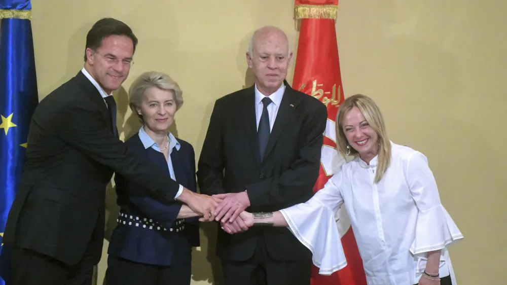 In this photo provided by the Tunisian Presidency, Tunisian President Kais Saied, centre, right, shakes hand with Netherlands' Prime Minister Mark Rutte, left, European Commission President Ursula von der Leyen and Italian Prime Minister Giorgia Meloni, right, at the presidential palace in Carthage, Tunisia, Sunday, July 16, 2023. European leaders and Tunisia's president have announced progress in the building of hoped-for closer economic and trade relations and on measures to combat the often lethal smuggling of migrants across the Mediterranean Sea. (Tunisian Presidency via AP)