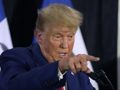 CORRECTS CITY AND LOCATION - Former President Donald Trump speaks to campaign volunteers at the Elks Lodge, Tuesday, July 18, 2023, in Cedar Rapids, Iowa. (AP Photo/Charlie Neibergall)