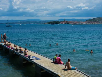 Izola, Sovenia - 10th July 2022. Locals and tourists enjoy the sun on the Adriatic coast of Slovenia near Izola