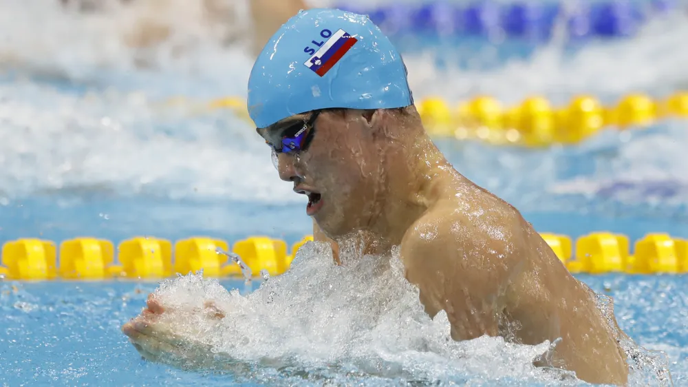 ﻿Slovenia's Peter John Stevens competes in a men's 50-meter breaststroke semifinal during the European Swimming Championships at the London Aquatics Centre in London, Friday, May 20, 2016. (AP Photo/Matt Dunham)