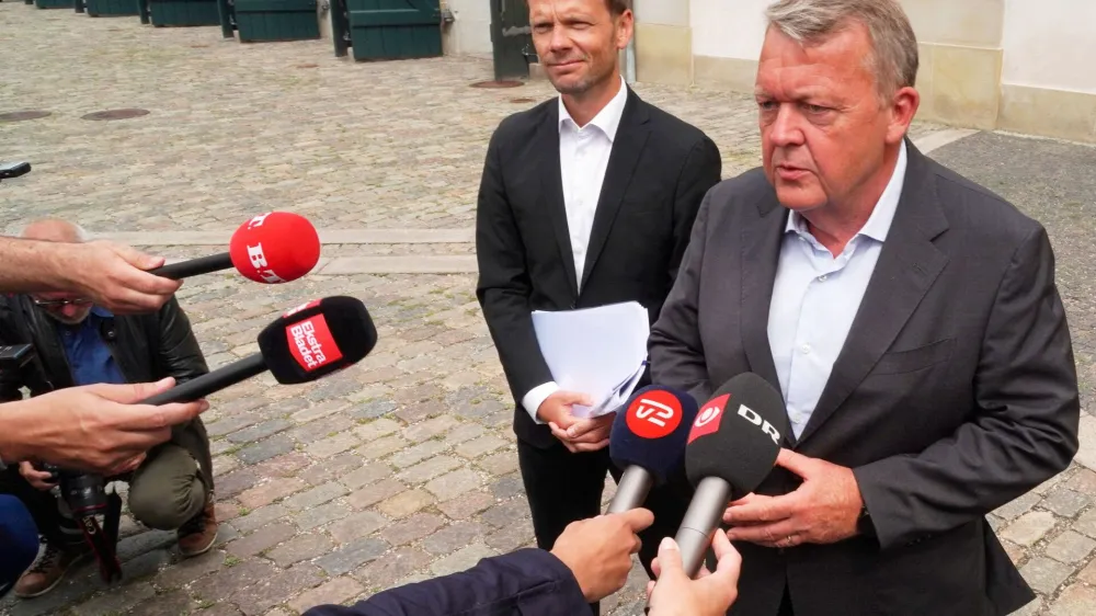 Danish Foreign Minister Lars Lokke Rasmussen and Justice Minister Peter Hummelgaard speak to journalists outside the foreign ministry in Copenhagen, Denmark, July 31, 2023. REUTERS/Tom Little