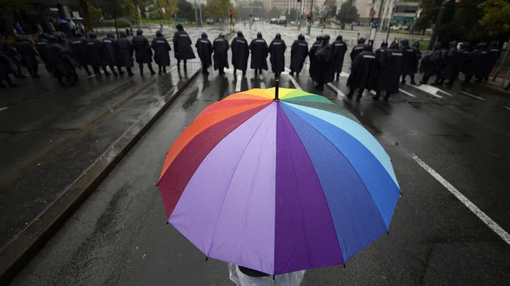 Serbian riot policemen line up to prevent anti-gay protesters from clashing with participants in the European LGBTQ pride march march in Belgrade, Serbia, Saturday, Sept. 17, 2022. Amid mounting tensions, police were deployed Saturday in downtown Belgrade where a Pride march was expected to be held despite threats from anti-gay groups and an official earlier ban. (AP Photo/Darko Vojinovic)