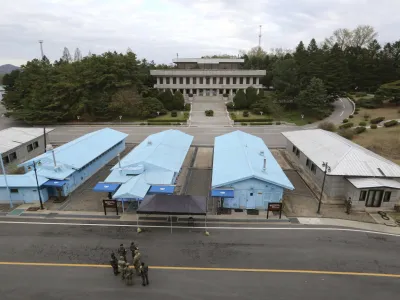 FILE - South Korean and U.S. Army soldiers, wearing gray uniforms, gather during a rehearsal to mark the first anniversary of a summit between South Korean President Moon Jae-in and North Korean leader Kim Jong Un, at the border village of Panmunjom in the demilitarized zone (DMZ) between the two Koreas in Paju, South Korea, on April 26, 2019. An American has crossed the heavily fortified border from South Korea into North Korea, the American-led U.N. Command overseeing the area said Tuesday, July 18, 2023, amid heightened tensions over North Korea's nuclear program. (AP Photo/Ahn Young-joon, File)