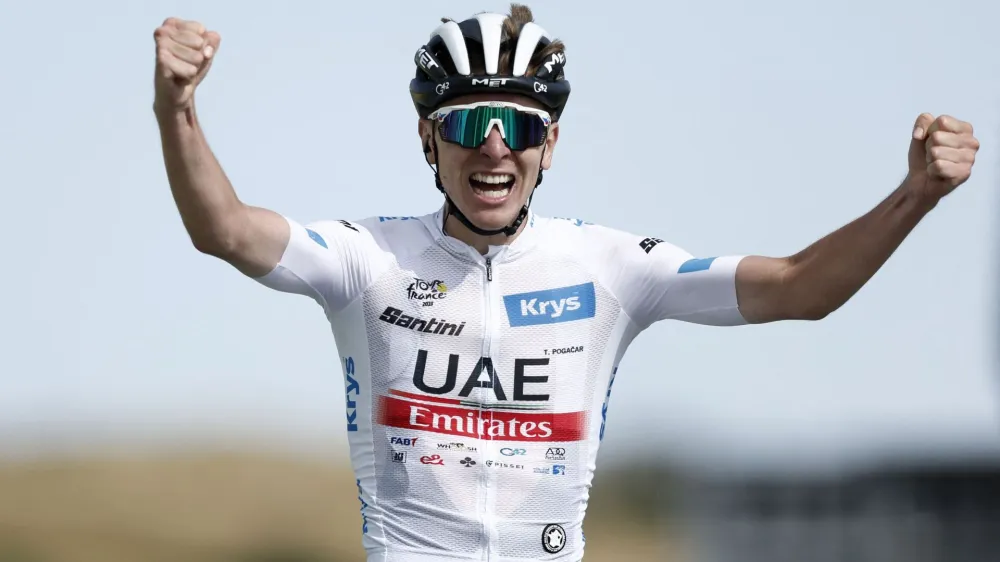 Cycling - Tour de France - Stage 20 - Belfort to Le Markstein Fellering - France - July 22, 2023 UAE Team Emirates' Tadej Pogacar celebrates as he crosses the finish line to win stage 20 REUTERS/Benoit Tessier