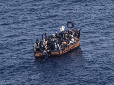 PRODUCTION - 29 June 2023, Italy, Lampedusa: Migrants trying to reach the Italian island of Lampedusa from the northern coast of Africa are apparently adrift in the Mediterranean Sea with engine trouble. More and more African refugees are crossing to Italy from Tunisia. Many migrants pay a high price for the journey, not only financially. Photo: Oliver Weiken/dpa