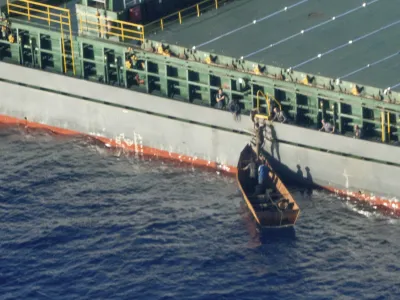 Four migrant survivors board on a commercial tanker, the Maltese-flagged Rimona, Tuesday, Aug. 8, 2023. Forty-one people are believed dead after a boat carrying migrants capsized off Tunisia in rough seas, the Italian Red Cross and rescue groups reported, citing four survivors who were rescued and brought to land Wednesday. The survivors reported having left Sfax, Tunisia, on a metal boat with a total of 45 people on Aug. 3. About six hours into their voyage, a huge wave overturned the vessel, RAI state television reported. (Karolina Sobel/Sea-Watch Via AP)