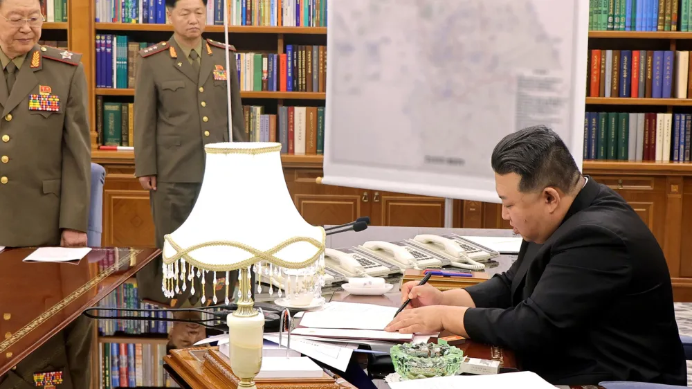 10 August 2023, North Korea, Pyongyang: An image provided by North Korea's state news agency KCNA on 10 August 2023 shows Supreme Leader of North Korea Kim Jong Un (R) chairs a meeting of the Workers' Party's Central Military Commission at the party's headquarters in Pyongyang. Photo: -/YNA/dpa