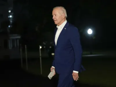 President Joe Biden walks across the South Lawn of the White House in Washington, Thursday, Aug. 10, 2023, after returning from a 4-day trip to Arizona, New Mexico and Utah. (AP Photo/Susan Walsh)