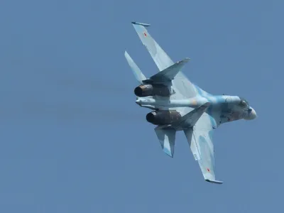 A Russian Sukhoi SU-30 fighter jet flies during Venezuela's independence day military parade in Fort Tiuna in Caracas, Venezuela, Wednesday, July 5, 2006. Venezuela has bought 100,000 Russian-made AK-103 assault rifles, 15 Russian military helicopters and wants to close a deal for 24 Sukhoi fighter jets, when Chavez travels to Moscow later this month. (AP Photo/Gregorio Marrero)
