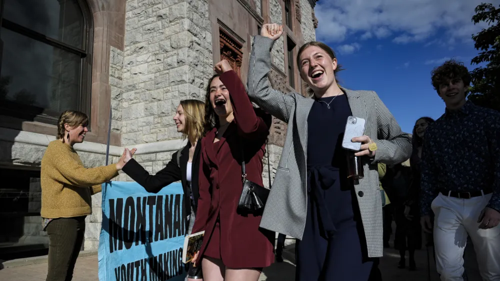 FILE - Youth plaintiffs in the climate change lawsuit, Held vs. Montana, arrive at the Lewis and Clark County Courthouse, on June 20, 2023, in Helena, Mont., for the final day of the trial. A Montana judge on Monday, Aug. 14, sided with young environmental activists who said state agencies were violating their constitutional right to a clean and healthful environment by permitting fossil fuel development without considering its effect on the climate. (Thom Bridge/Independent Record via AP, File)