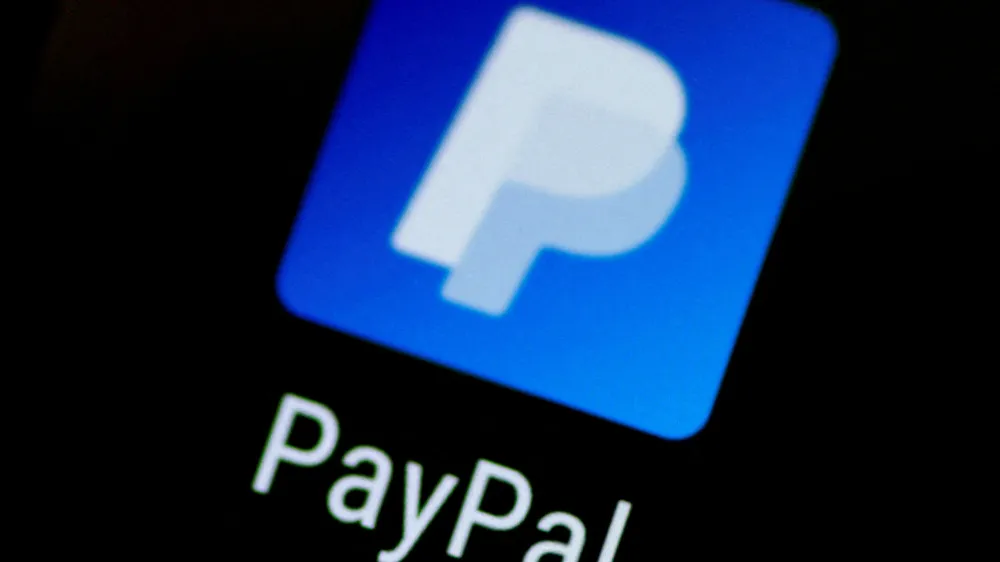 FILE PHOTO: The PayPal app logo seen on a mobile phone in this illustration photo October 16, 2017. REUTERS/Thomas White/File Photo