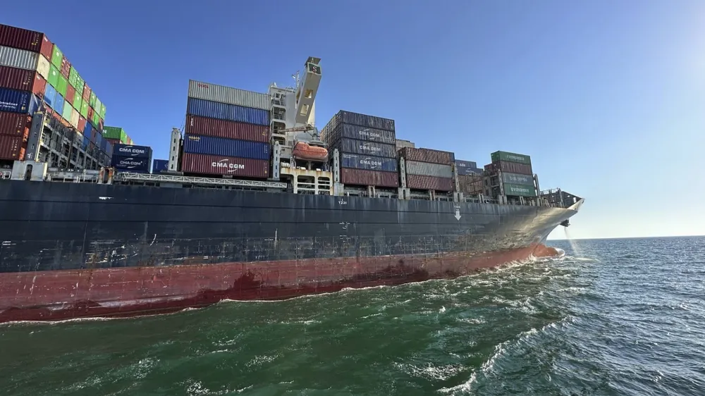 In this photo provided by Ukraine's Infrastructure Ministry Press Office, container ship Joseph Schulte (Hong Kong flag) leaves the port of Odesa to proceed through the temporary corridor established for merchant vessels from Ukraine's Black Sea ports in Odesa, Ukraine, Wednesday, Aug. 16, 2023. The ship carrying over 30 thousand tons of cargo, including food products, which had been in the port of Odesa since last February because of the Russian invasion of Ukraine, left Odessa under an agreement between Ukraine and the International Maritime Organisation. (Ukraine's Infrastructure Ministry Press Office via AP)