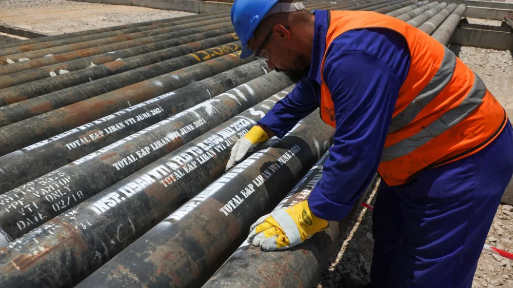 A worker checks gas pipelines at TotalEnergies logistics base at Beirut Port, Lebanon July 25, 2023. REUTERS/Mohamed Azakir