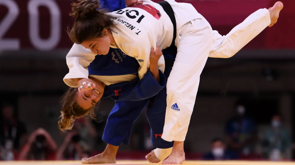 ﻿Tokyo 2020 Olympics - Judo - Women's 57kg - Repechage Round - Nippon Budokan - Tokyo, Japan - July 26, 2021. Kaja Kajzer of Slovenia scores ippon against Timna Nelson Levy of Israel REUTERS/Annegret Hilse