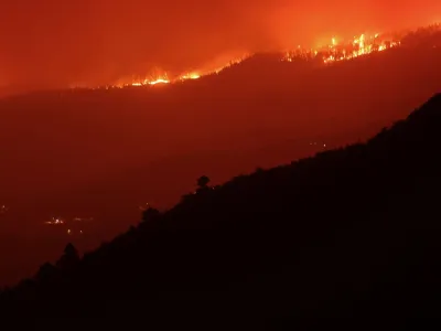 A view shows a fire over the mountains near empty houses after the evacuation in different villages in the north, as wildfires rage out of control on the island of Tenerife, Canary Islands, Spain August 20, 2023. REUTERS/Nacho Doce