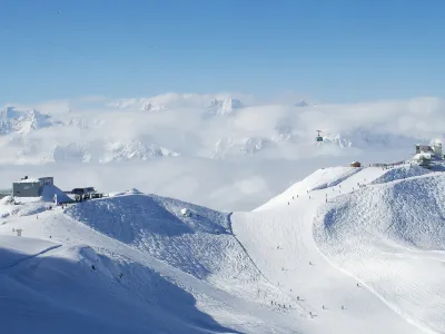 ﻿Cable car station on the top of swiss mountains with mont blanc on the background