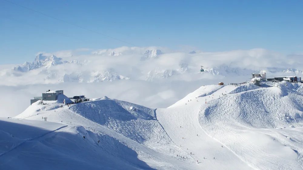 ﻿Cable car station on the top of swiss mountains with mont blanc on the background