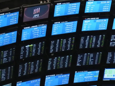 Electronic stock boards are seen at Tokyo Stock Exchange Friday, Aug. 18, 2023 in Tokyo, Japan. Asian shares mostly rose Thursday, Aug. 24, after Wall Street rallied to its best day since June after pressures from the bond market relaxed a bit. (AP Photo/Shuji Kajiyama)