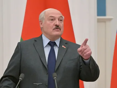 FILE PHOTO: Belarusian President Alexander Lukashenko gestures during a joint news conference with Russian President Vladimir Putin in Moscow, Russia February 18, 2022. Sputnik/Sergey Guneev/Kremlin via REUTERS ATTENTION EDITORS - THIS IMAGE WAS PROVIDED BY A THIRD PARTY./File Photo