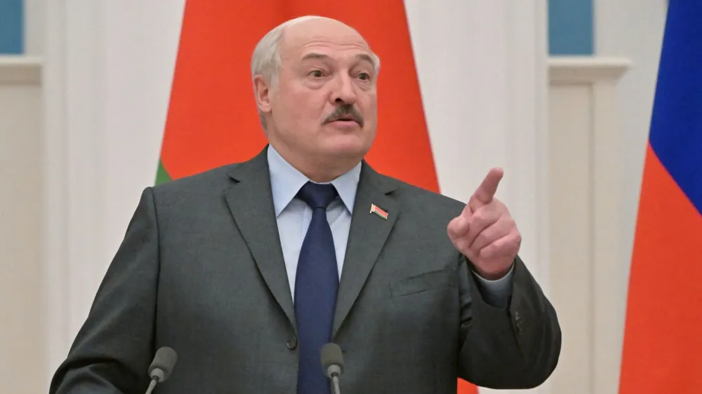 FILE PHOTO: Belarusian President Alexander Lukashenko gestures during a joint news conference with Russian President Vladimir Putin in Moscow, Russia February 18, 2022. Sputnik/Sergey Guneev/Kremlin via REUTERS ATTENTION EDITORS - THIS IMAGE WAS PROVIDED BY A THIRD PARTY./File Photo