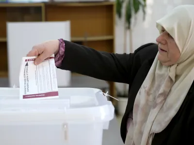 A woman casts her ballot during presidential and parliamentary elections at a polling centre in a school in Babino near Zenica, Bosnia and Herzegovina October 7, 2018.  REUTERS/Dado Ruvic - RC1A3A281820