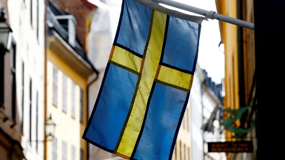 FILE PHOTO: The Swedish flag is seen at Gamla Stan, the Old City of Stockholm, Sweden, May 7, 2017. REUTERS/Ints Kalnins/File Photo