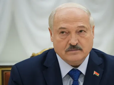 FILE - Belarusian President Alexander Lukashenko listens, during his meeting with foreign correspondents, in Minsk, Belarus, on July 6, 2023. A former member of Lukashenko's special security forces is set to face trial in Switzerland next month for the forced disappearances of political opponents in the late 1990s, according to human rights and victims advocacy groups Wednesday Aug. 30, 2023. (AP Photo/Alexander Zemlianichenko, File)