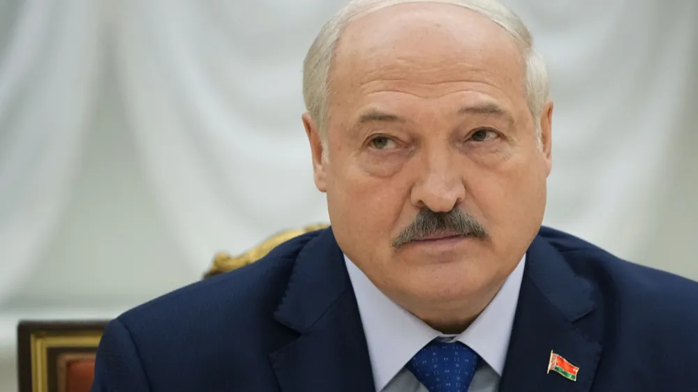 FILE - Belarusian President Alexander Lukashenko listens, during his meeting with foreign correspondents, in Minsk, Belarus, on July 6, 2023. A former member of Lukashenko's special security forces is set to face trial in Switzerland next month for the forced disappearances of political opponents in the late 1990s, according to human rights and victims advocacy groups Wednesday Aug. 30, 2023. (AP Photo/Alexander Zemlianichenko, File)