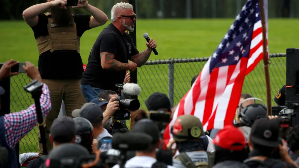 FILE PHOTO: Proud Boys member Joe Biggs speaks during a rally in Portland, Oregon, September 26, 2020, before he was later arrested for his involvement in the storming of the U.S. Capitol building in Washington. D.C., U.S. REUTERS/Jim Urquhart/File Photo