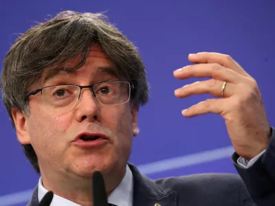 ﻿FILE PHOTO: Catalan MEP Carles Puigdemont gestures during a joint news conference with Catalan MEPs Antoni Comin and Clara Ponsati regarding their immunity at the European Parliament, in Brussels, Belgium June 3, 2021. REUTERS/Yves Herman/File Photo