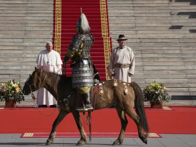 Mongolian President Ukhnaagin Khurelsukh, right, and Pope Francis meet, Saturday, Sept. 2, 2023, in front of the Saaral Ordon Government Building in Sukhbaatar Square in Ulaanbaatar. Pope Francis arrived in Mongolia on Friday morning for a four-day visit to encourage one of the world's smallest and newest Catholic communities. (AP Photo/Andrew Medichini)